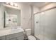 Bathroom with modern vanity and shower features a glass door, plus a view of neighborhood at 11132 Via Lata Dr, Broomfield, CO 80020