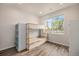 Bedroom features a bunk bed and large window with a view of the residential neighborhood at 11132 Via Lata Dr, Broomfield, CO 80020