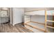 A bedroom offers bunk beds, closet, and convenient access to an ensuite bathroom at 11132 Via Lata Dr, Broomfield, CO 80020
