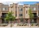 Beautiful townhomes featuring stone accents, modern siding, and professional landscaping at 11132 Via Lata Dr, Broomfield, CO 80020