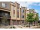 Stylish townhomes with attractive siding, stone accents, and well-maintained landscaping at 11132 Via Lata Dr, Broomfield, CO 80020