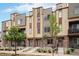 Handsome townhomes featuring stone accents, modern siding, and well-kept landscaping at 11132 Via Lata Dr, Broomfield, CO 80020