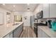Modern kitchen showcasing granite countertops, stainless appliances, and ample cabinet space at 11132 Via Lata Dr, Broomfield, CO 80020