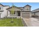 Charming two-story home with a welcoming front porch and well-maintained landscaping at 1420 E Witherspoon Dr, Elizabeth, CO 80107