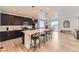 Bright kitchen with a large island, bar stool seating and easy access to the dining area at 1420 E Witherspoon Dr, Elizabeth, CO 80107