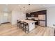 Modern kitchen with stainless steel appliances, spacious island, and stylish pendant lighting at 1420 E Witherspoon Dr, Elizabeth, CO 80107