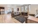Inviting living room with a plush gray sofa, black and white rug, and bright natural light at 1420 E Witherspoon Dr, Elizabeth, CO 80107
