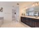 Contemporary main bathroom with double vanity sinks and sleek cabinetry at 1420 E Witherspoon Dr, Elizabeth, CO 80107