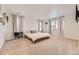 Bright and spacious main bedroom with a large bed and ample natural light at 1420 E Witherspoon Dr, Elizabeth, CO 80107