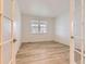 Versatile room with wood floors and a large window, perfect as an office or den at 1420 E Witherspoon Dr, Elizabeth, CO 80107