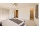 Bright bedroom with double doors leading to the bathroom and walk-in closet at 13627 W Alaska Dr, Lakewood, CO 80228