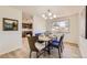 Dining area with a wood table and blue chairs at 13627 W Alaska Dr, Lakewood, CO 80228