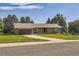 Brick ranch house with attached garage and landscaped lawn at 13627 W Alaska Dr, Lakewood, CO 80228