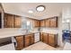 Kitchen with wood cabinets and modern appliances at 13627 W Alaska Dr, Lakewood, CO 80228