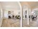 Open living and dining area with arched doorways at 13627 W Alaska Dr, Lakewood, CO 80228