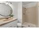 Bathroom with shower, newer vanity, and modern lighting at 11532 Newland St, Westminster, CO 80020