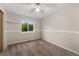 A bedroom featuring carpet flooring, a chair railing and a window providing natural light at 11532 Newland St, Westminster, CO 80020