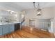 Open kitchen with hardwood floors and view to staircase at 11532 Newland St, Westminster, CO 80020