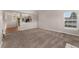 Bright living room featuring neutral carpeting, large windows, and an open concept design at 11532 Newland St, Westminster, CO 80020