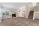 Inviting living room with cozy fireplace, window seat, and staircase access at 11532 Newland St, Westminster, CO 80020