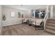 Sitting room with two chairs and view into the kitchen at 11532 Newland St, Westminster, CO 80020