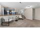 Sitting room with two chairs and view into the kitchen at 11532 Newland St, Westminster, CO 80020
