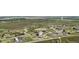 Aerial view of homes in a community surrounded by open land and walking paths at 1180 Antelope W Dr, Bennett, CO 80102