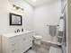 Clean and modern bathroom featuring a vanity with drawers, a shower, and neutral colors at 1180 Antelope W Dr, Bennett, CO 80102