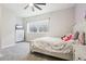 Charming bedroom featuring comfortable bed, dresser, and ample natural light at 1180 Antelope W Dr, Bennett, CO 80102