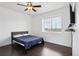 Bedroom featuring a ceiling fan and hardwood floors at 1180 Antelope W Dr, Bennett, CO 80102