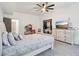 Inviting bedroom features a ceiling fan and storage with closet for functional living at 1180 Antelope W Dr, Bennett, CO 80102