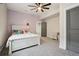 Cozy bedroom features a full sized bed, and a ceiling fan, providing comfort at 1180 Antelope W Dr, Bennett, CO 80102