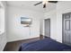 Bedroom featuring a ceiling fan and hardwood floors at 1180 Antelope W Dr, Bennett, CO 80102