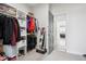Walk-in closet with ample shelving and hanging space, providing organized storage solutions with an ensuite at 1180 Antelope W Dr, Bennett, CO 80102