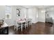 Bright dining room with a dining table and wood flooring at 1180 Antelope W Dr, Bennett, CO 80102