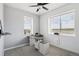 Bright home office with two windows and ceiling fan at 1180 Antelope W Dr, Bennett, CO 80102