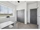 Bright home office with large window and gray closets at 1180 Antelope W Dr, Bennett, CO 80102