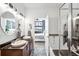 Bathroom featuring dual sinks, granite countertops, and separate shower and tub for a spa-like experience at 2706 Blake St, Denver, CO 80205