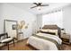 Bright bedroom with ceiling fan, sleek mirror, and stylish decor at 2706 Blake St, Denver, CO 80205