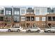 Modern townhome exterior with a brick facade, grey siding, and street parking available in front at 2706 Blake St, Denver, CO 80205