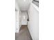 Neutral hallway with carpet floors, white walls, and modern lighting offering a seamless flow between rooms at 2706 Blake St, Denver, CO 80205