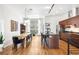 Spacious kitchen featuring an island with seating, stainless steel appliances, and modern lighting at 2706 Blake St, Denver, CO 80205