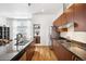 Modern kitchen with stainless steel appliances, granite countertops, and an island at 2706 Blake St, Denver, CO 80205