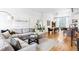 Cozy living room featuring a large sectional sofa, round coffee table, and bright natural light at 2706 Blake St, Denver, CO 80205