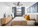 Stylish main bedroom featuring a king-size bed, natural light, and decor at 2706 Blake St, Denver, CO 80205