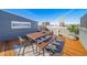 Rooftop deck with outdoor seating, dining area, and great views of city buildings and skyline at 2706 Blake St, Denver, CO 80205