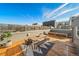 Outdoor rooftop deck featuring outdoor seating, table, grill, and views of the neighborhood at 2706 Blake St, Denver, CO 80205