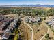 Expansive aerial view showcasing houses, walking trails, and mountain views at 973 Treece St, Louisville, CO 80027