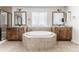 Spacious bathroom featuring a large soaking tub, dual sinks, and tiled accents at 973 Treece St, Louisville, CO 80027