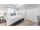 Relaxing bedroom featuring a comfortable bed, soft carpet, and natural light from a window, creating a serene retreat at 973 Treece St, Louisville, CO 80027